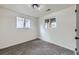 Bedroom with two windows, neutral walls, and cozy carpeting at 6876 Quay Ct, Arvada, CO 80003