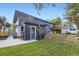 Backyard view highlighting the outdoor bar area, with a deck and ample green space, a perfect spot for outdoor gatherings at 6876 Quay Ct, Arvada, CO 80003