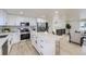 Modern kitchen with stainless appliances, a kitchen island, and an open layout at 6876 Quay Ct, Arvada, CO 80003
