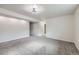 Spacious basement area with ample lighting and neutral carpeting at 6876 Quay Ct, Arvada, CO 80003