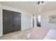 Main bedroom featuring a large closet and a view of the bathroom at 6876 Quay Ct, Arvada, CO 80003
