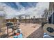Spacious backyard with stone patio, grill, exercise equipment, and landscaping at 16463 E Girard Ave, Aurora, CO 80013