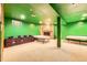 Finished basement with stone fireplace, massage tables, and carpeting creates a flexible space at 16463 E Girard Ave, Aurora, CO 80013