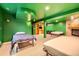 Finished basement featuring a stone fireplace, two beds, and access to a built-in bookshelf at 16463 E Girard Ave, Aurora, CO 80013