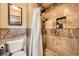 Full bathroom with a shower, designer tiled walls, and recessed shelving at 16463 E Girard Ave, Aurora, CO 80013