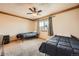Cozy bedroom featuring plush carpeting, a ceiling fan, and a bright window at 16463 E Girard Ave, Aurora, CO 80013