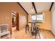 Dining room featuring pendant lighting, hardwood floors, and a view to the kitchen at 16463 E Girard Ave, Aurora, CO 80013