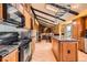 Kitchen with stainless steel appliances, granite countertops, wood cabinets, and vaulted ceilings at 16463 E Girard Ave, Aurora, CO 80013