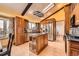 Kitchen with stainless steel appliances, skylight, wood cabinets and island with seating at 16463 E Girard Ave, Aurora, CO 80013