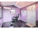 Cozy room with barber chair, mirror, air conditioner, and small windows, offering a unique space at 16463 E Girard Ave, Aurora, CO 80013