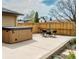 The backyard includes a hot tub, a patio and a full patio set at 357 Saturn Pl, Lone Tree, CO 80124