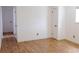 Bedroom with hardwood floors, white walls, and two closets at 357 Saturn Pl, Lone Tree, CO 80124
