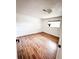 Bedroom with hardwood floors, white walls, and a bright window at 357 Saturn Pl, Lone Tree, CO 80124