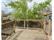Wooden deck with wood and metal railings overlooking the backyard at 357 Saturn Pl, Lone Tree, CO 80124