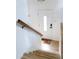 Bright foyer showcasing stairs, a front door with glass accent, and hardwood floors at 357 Saturn Pl, Lone Tree, CO 80124