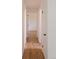 Hallway featuring hardwood floors and white walls at 357 Saturn Pl, Lone Tree, CO 80124