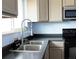 Updated kitchen showcasing sleek countertops, stainless steel appliances, and modern faucet at 357 Saturn Pl, Lone Tree, CO 80124