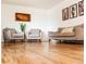 Comfortable living area featuring hardwood floors and neutral colored furnishings at 357 Saturn Pl, Lone Tree, CO 80124