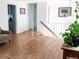 Bright living room showcasing hardwood floors, neutral paint, and a staircase at 357 Saturn Pl, Lone Tree, CO 80124