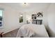 Well-lit bedroom featuring a double bed and tasteful wall art at 11292 Main Range Trl, Littleton, CO 80127