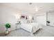 Bright bedroom features a ceiling fan, neutral tones, and soft carpet at 932 Quentin St, Aurora, CO 80011