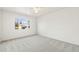 Spacious bedroom with neutral carpet and large window at 932 Quentin St, Aurora, CO 80011