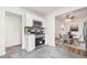 Modern kitchen with stainless steel appliances and white cabinetry, adjacent to the dining area at 932 Quentin St, Aurora, CO 80011