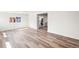 Open-concept living space with bright, modern flooring at 932 Quentin St, Aurora, CO 80011