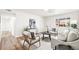 Cozy living room featuring contemporary furnishings, a neutral palette, and a view of the neighborhood at 932 Quentin St, Aurora, CO 80011