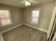 Well-lit bedroom with two windows and wood-look floors at 504 Quitman St, Denver, CO 80204