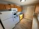 Efficient kitchen with wood cabinets and modern appliances at 504 Quitman St, Denver, CO 80204