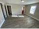 Bright living room featuring gray walls and wood-look floors at 504 Quitman St, Denver, CO 80204