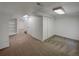 Finished basement with neutral carpet, recessed lighting, and additional closet space at 7604 S Steele St, Centennial, CO 80122