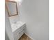 Bathroom vanity with sink, decorative mirror, and storage; modern and functional at 7604 S Steele St, Centennial, CO 80122