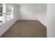 Bright bedroom with plush carpeting, closet and a large window offering natural light at 7604 S Steele St, Centennial, CO 80122