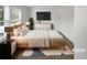 Cozy bedroom with a comfortable bed, minimalist decor, and ample natural light from the window at 7604 S Steele St, Centennial, CO 80122