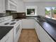Efficient kitchen with modern appliances, sleek countertops, and ample cabinet space at 7604 S Steele St, Centennial, CO 80122