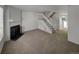 Open living area with a fireplace and staircase, great for entertaining and relaxation at 7604 S Steele St, Centennial, CO 80122