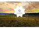 Community landscape view at sunset at 9637 Browns Peak Cir, Littleton, CO 80125
