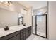 Modern bathroom with double vanity and large shower at 9637 Browns Peak Cir, Littleton, CO 80125