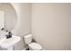 Modern bathroom with pedestal sink and toilet at 9637 Browns Peak Cir, Littleton, CO 80125