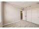 Bright bedroom with carpeted floor and double door closet at 9637 Browns Peak Cir, Littleton, CO 80125