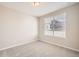 Spacious bedroom with carpeted floor and large window at 9637 Browns Peak Cir, Littleton, CO 80125