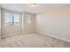 Spacious bedroom with carpeted floors and large window at 9637 Browns Peak Cir, Littleton, CO 80125