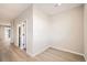 Bright hallway with light neutral walls and flooring at 9637 Browns Peak Cir, Littleton, CO 80125