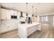 Modern kitchen with island, stainless steel appliances, and white cabinets at 9637 Browns Peak Cir, Littleton, CO 80125