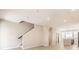 Open concept living room with kitchen and staircase at 9637 Browns Peak Cir, Littleton, CO 80125