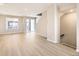 Bright and spacious living room with hardwood floors and access to balcony at 9637 Browns Peak Cir, Littleton, CO 80125