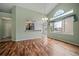 Inviting living room showcasing hardwood floors, an open layout, and natural light from large windows at 6689 Kendrick Dr, Arvada, CO 80007