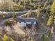 Charming home with a deck nestled in the forest and natural surroundings, showcasing mountain views at 9790 City View Dr, Morrison, CO 80465